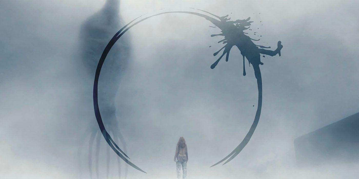 Linguist Louise Baker, played by Amy Adams, communicates through heavy fog with a shadowy alien through dark shapes in Arrival