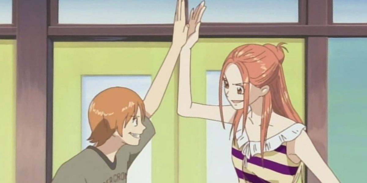Risa and Atsushi High-Fiving Each Other