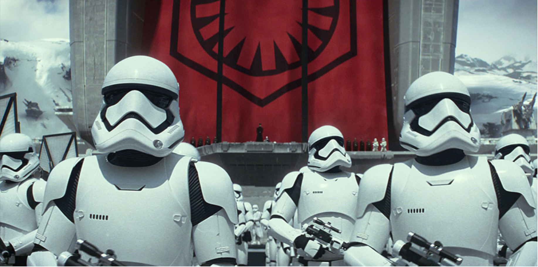 Stormtroopers standing in front of a First Order banner
