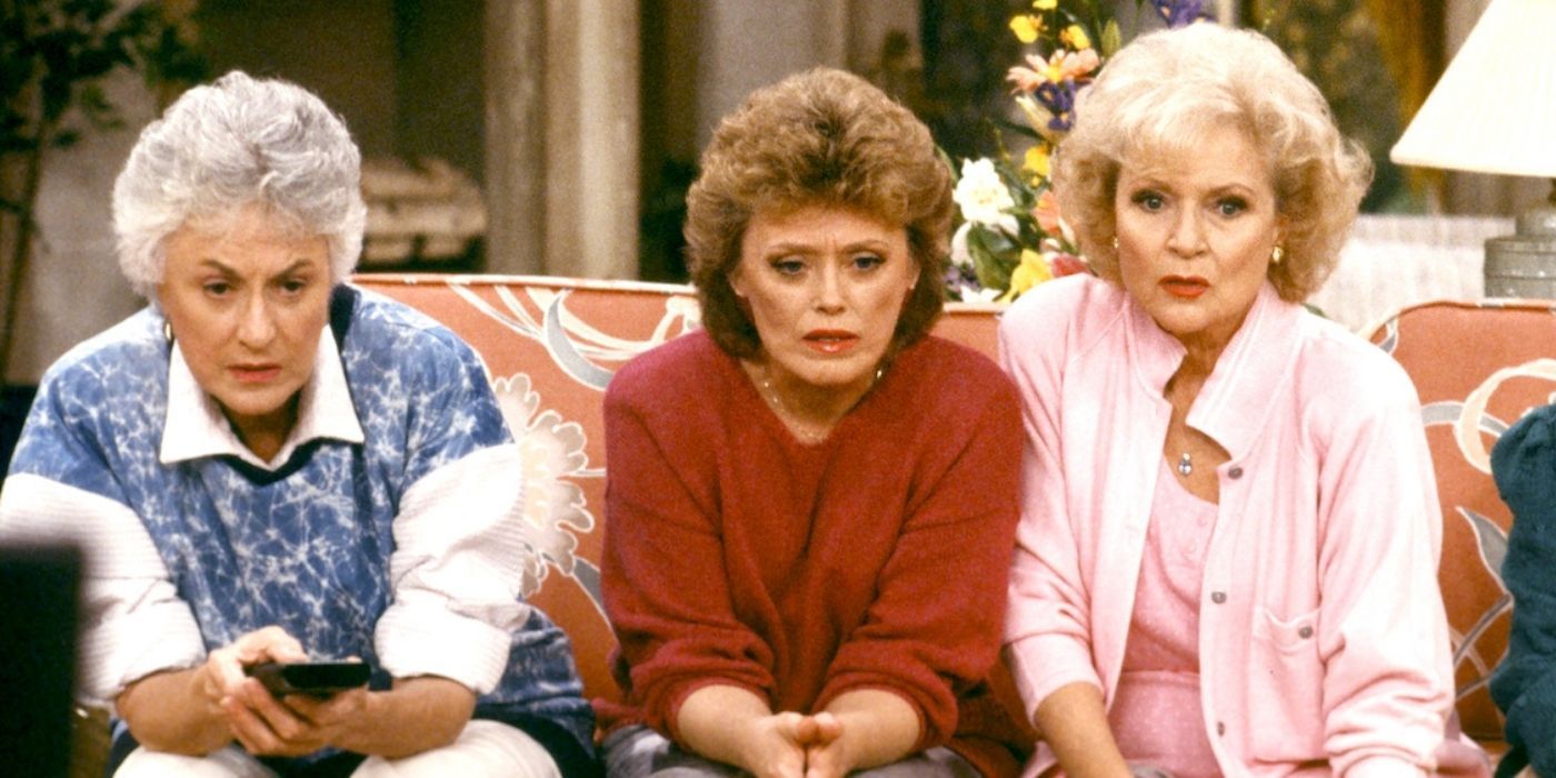 The Golden Girls' Blanche, Dorothy and Rose are sat together with surprised expressions