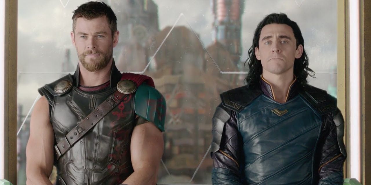 Thor smiling while Loki looks concerned on the elevator in Thor Ragnarok