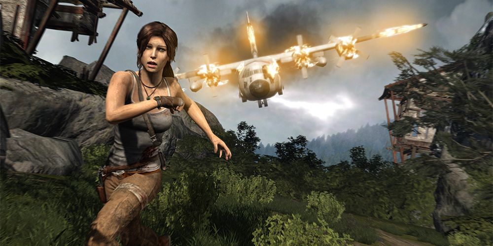 Lara Croft runs from a burning plane