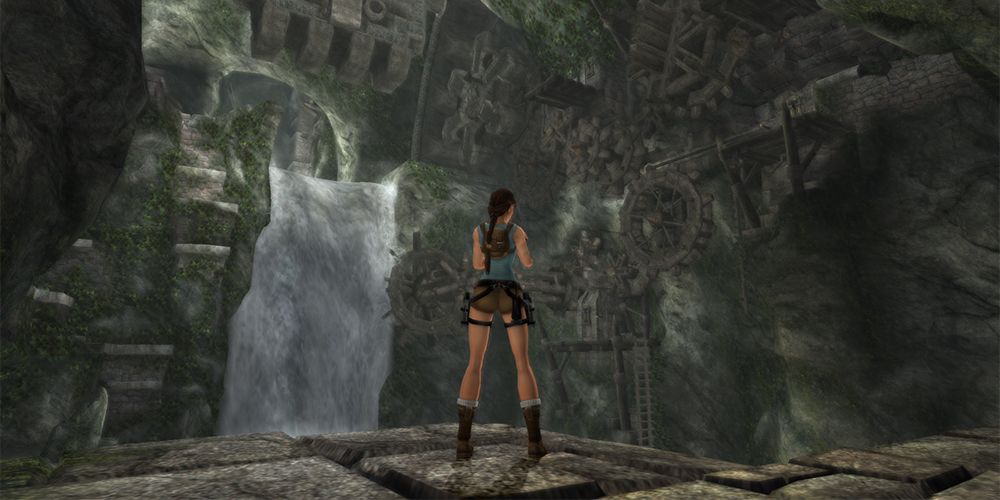Lara Croft studies a waterfall