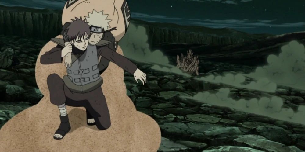 Gaara carrying Naruto on his sand platform