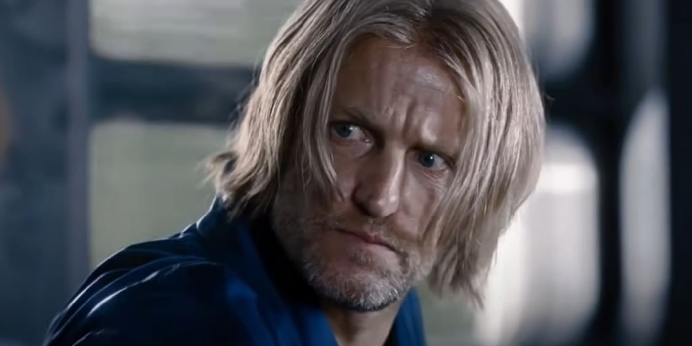 Haymitch looking at Katniss intensely in The Hunger Games.