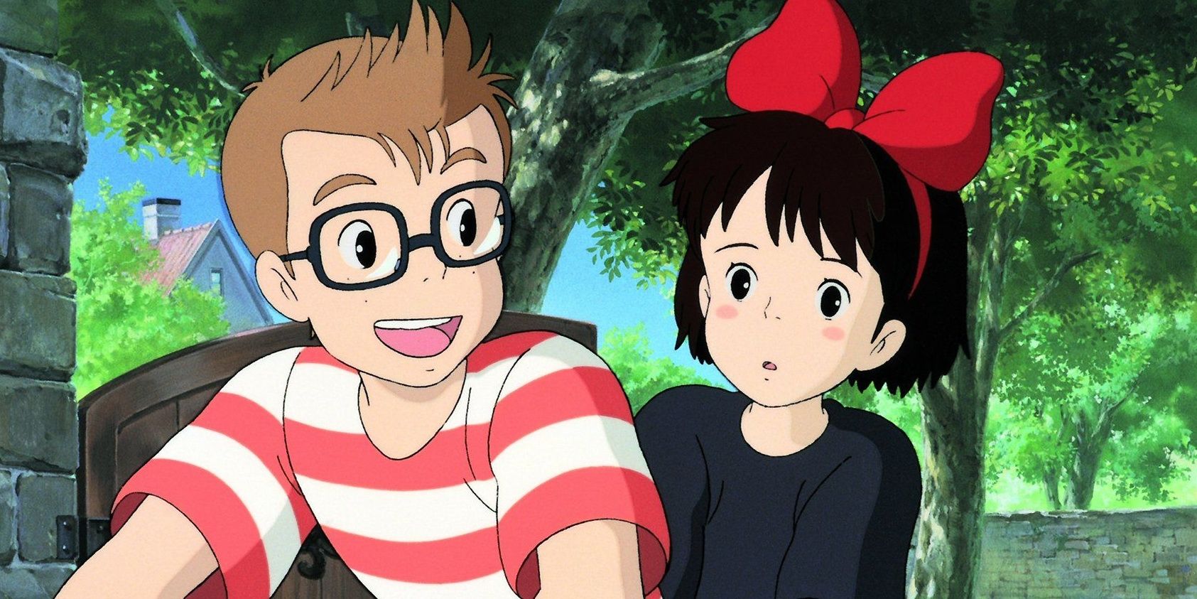 Kiki and Tombo smile and ride a bike from Kiki's Delivery Service
