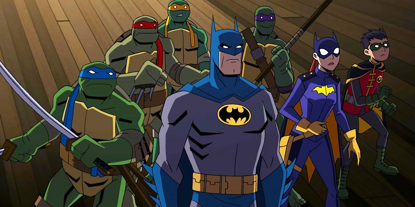 Batman, Batgirl and Robin pose with the Ninja Turtles