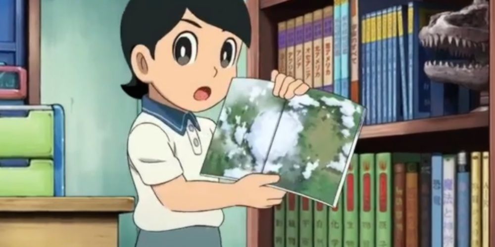 Dekisugi Doraemon holding a book open