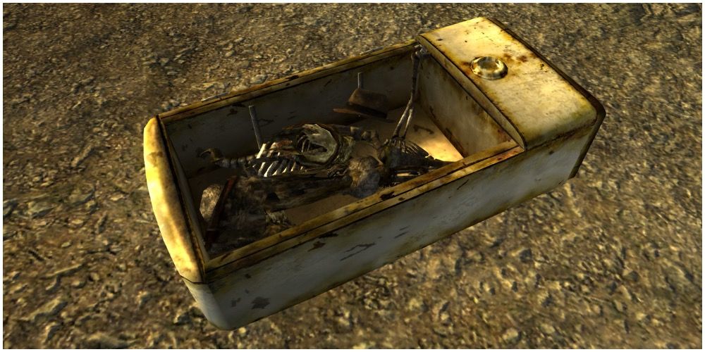 A fridge with the skeleton of a man and a fedora in Fallout New Vegas