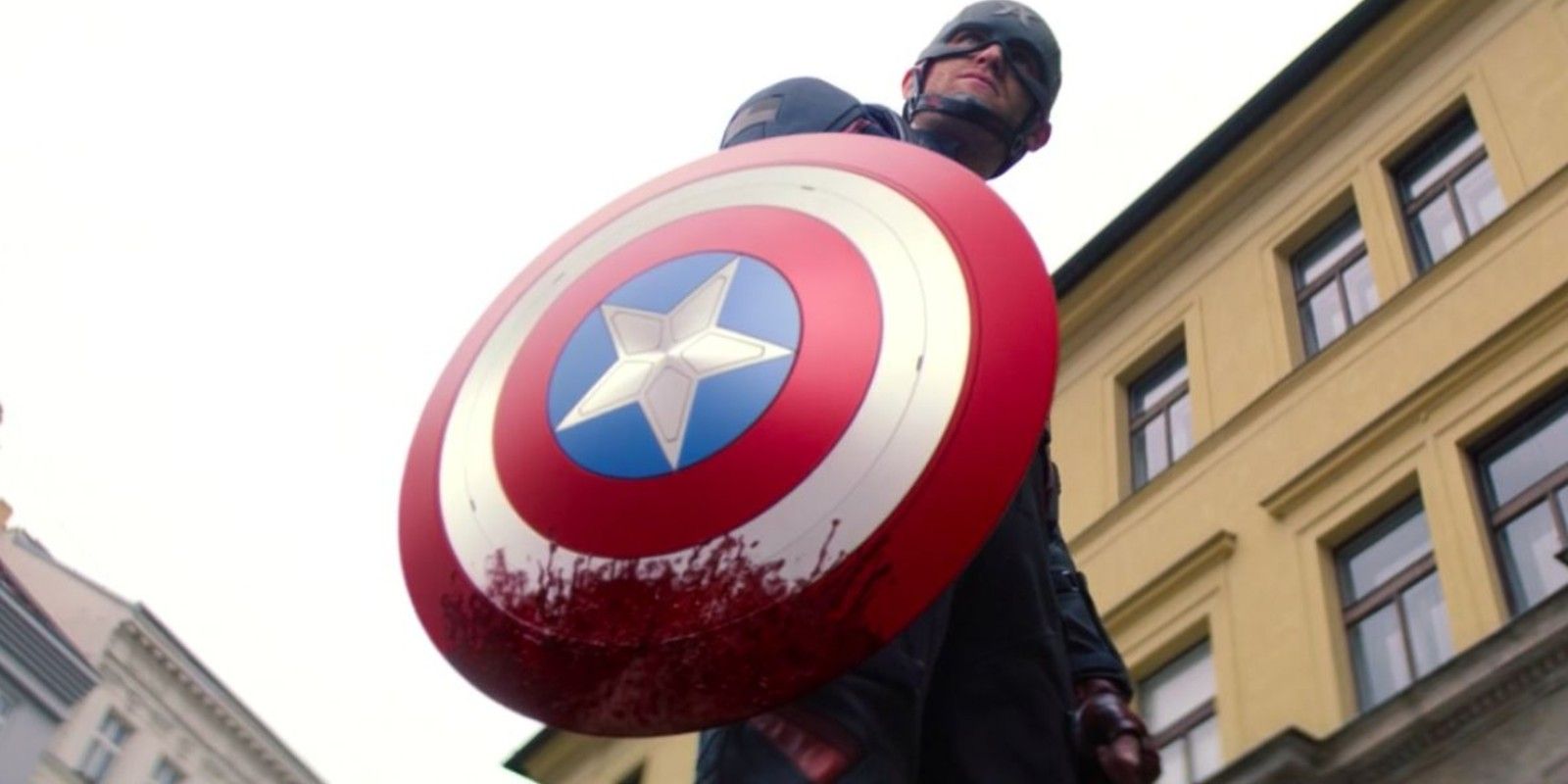 John Walker holds a bloody shield after killing a Flag Smasher in Falcon and the Winter Soldier