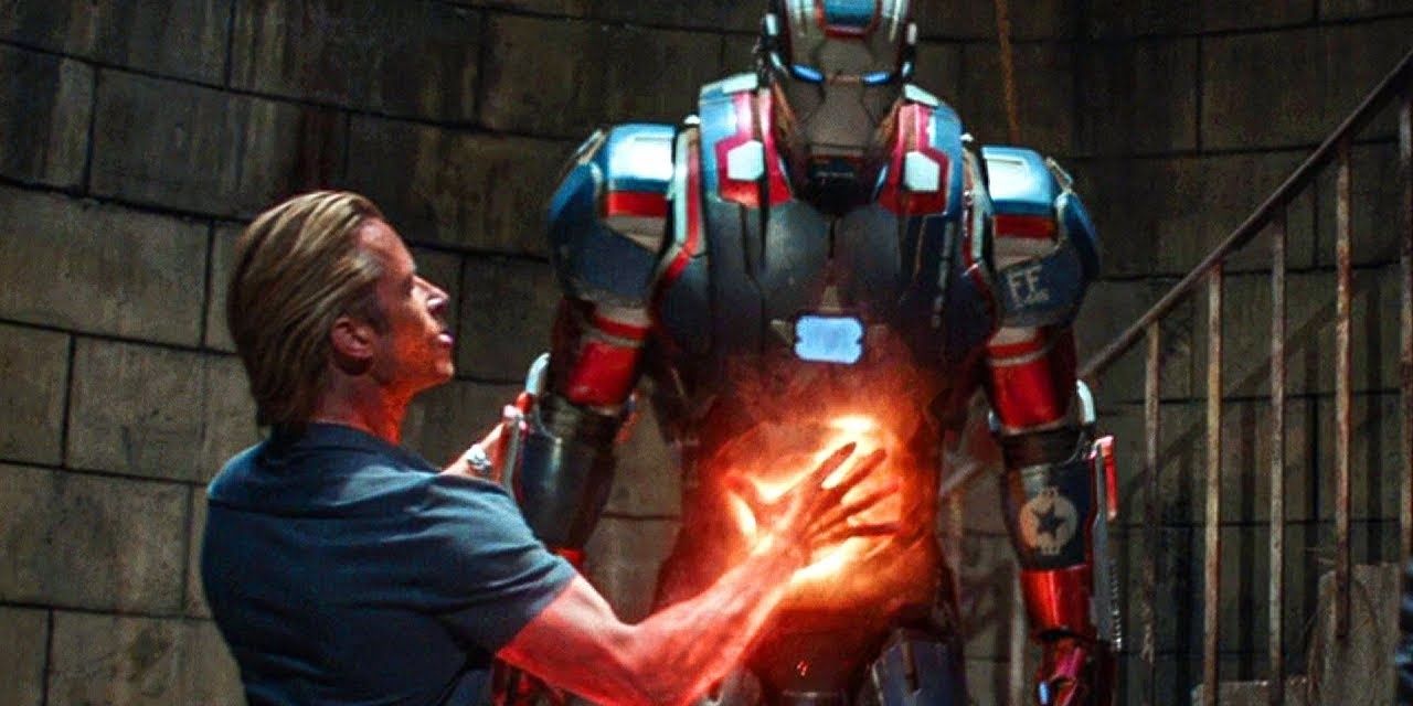 Killian cooking Rhodey in the Iron Patriot suit.