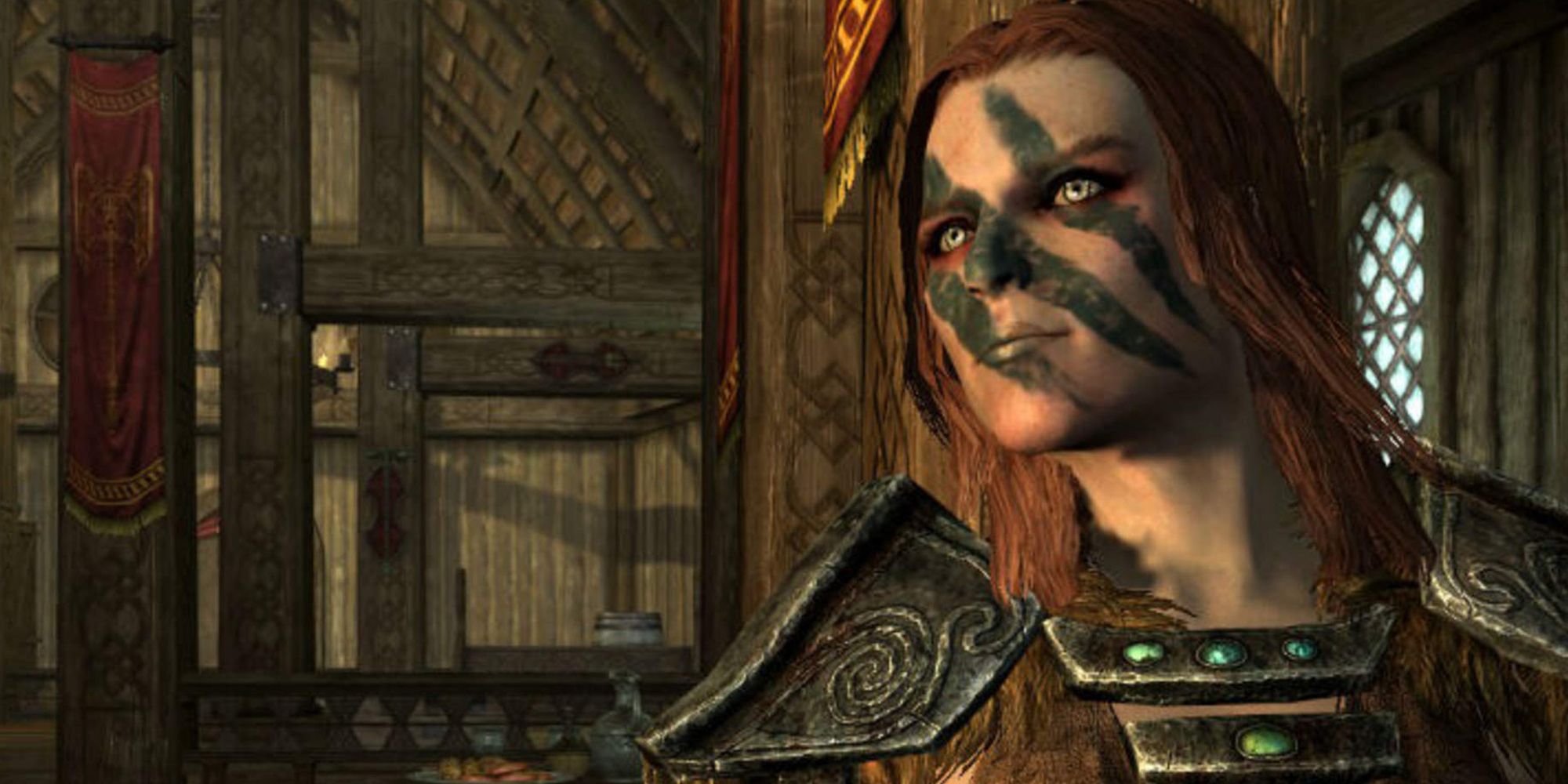 Aela the Huntress looking off camera with black paint on her face in Skyrim