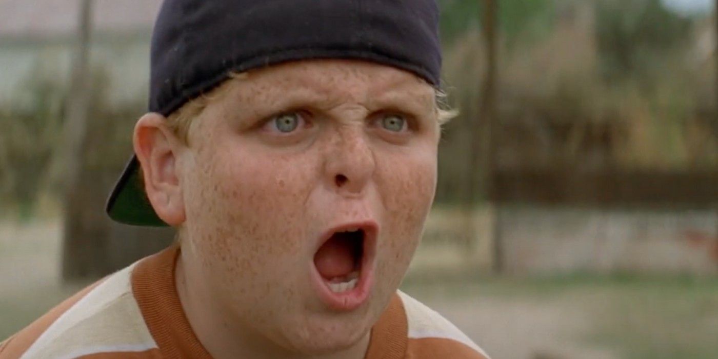Ham from Sandlot opens his mouth with surprise while standing in a baseball court