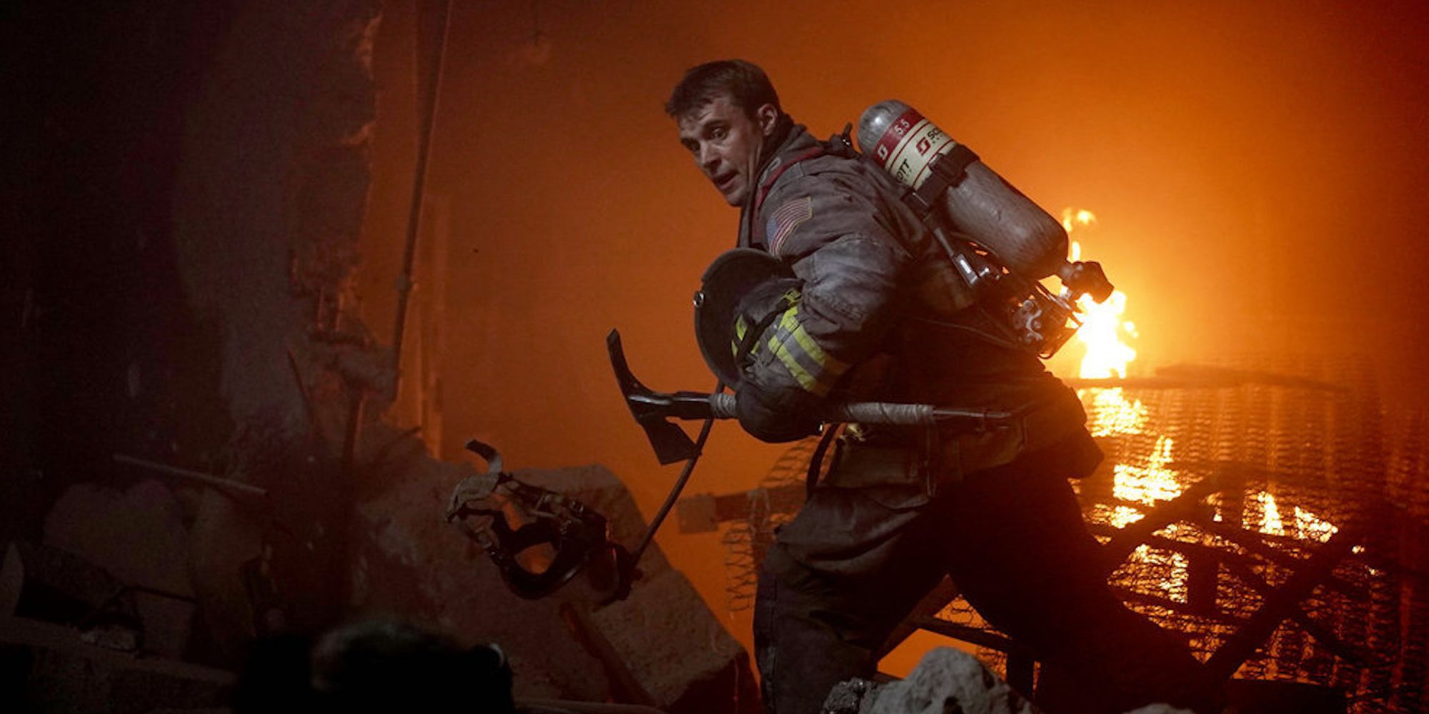 Chicago Fire's Matthew Casey (played by Jesse Spencer) moves through the burning mattress factory