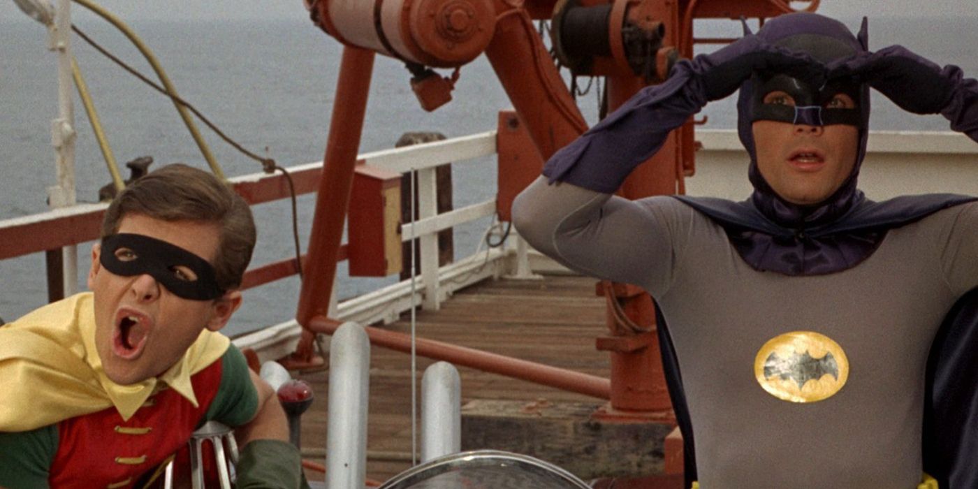 Adam West and Burt Ward as the Dynamic Duo in Batman The Movie aboard a ship.