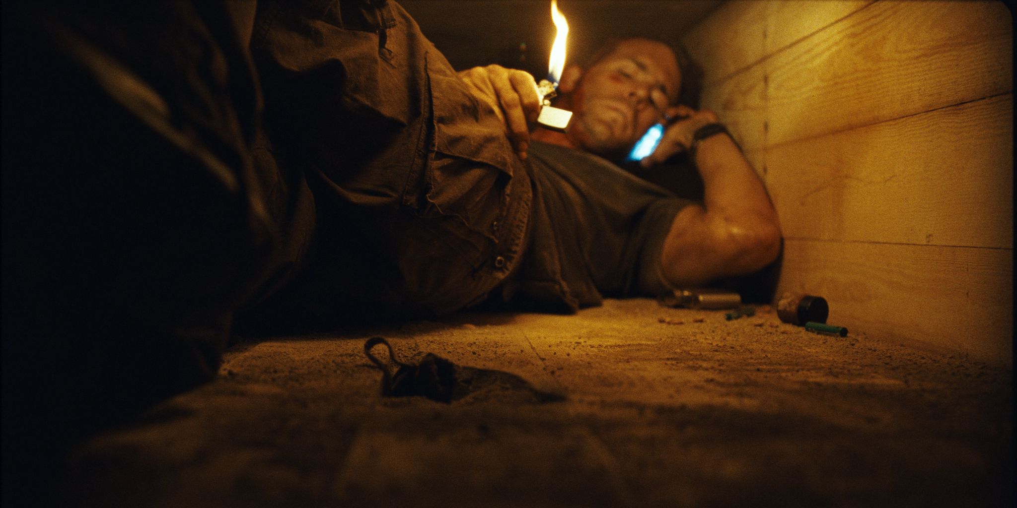 Ryan Reynolds investigates his coffin with a lighter in buried