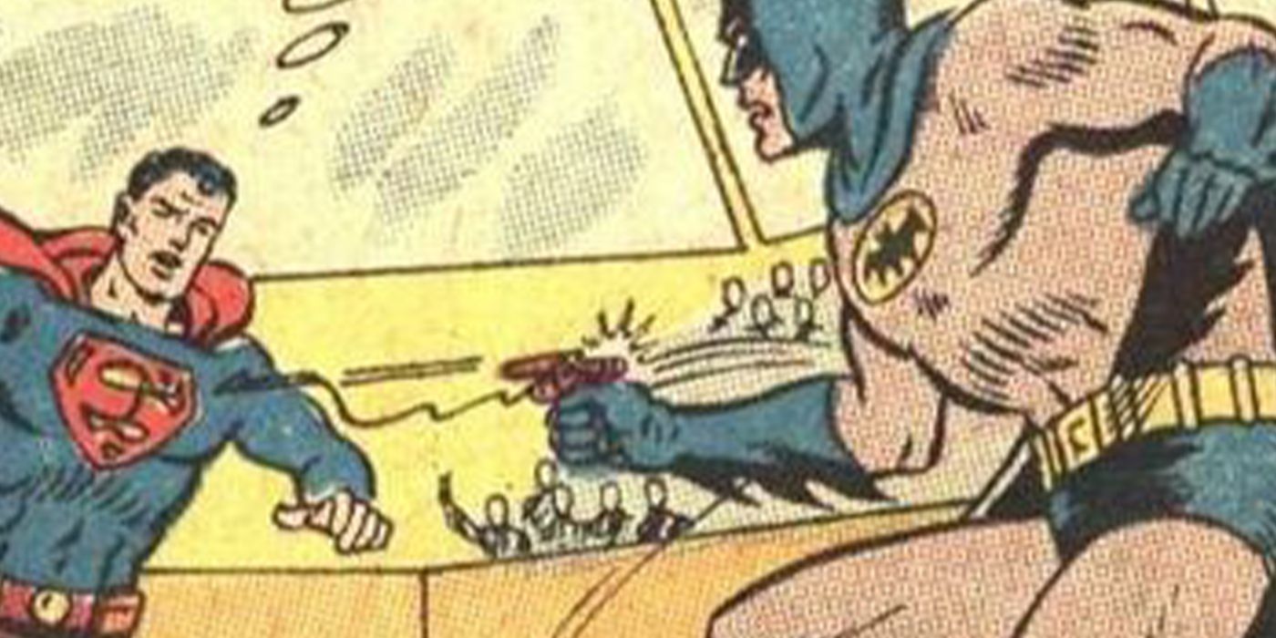 Batman fires his Batpoon at Superman.