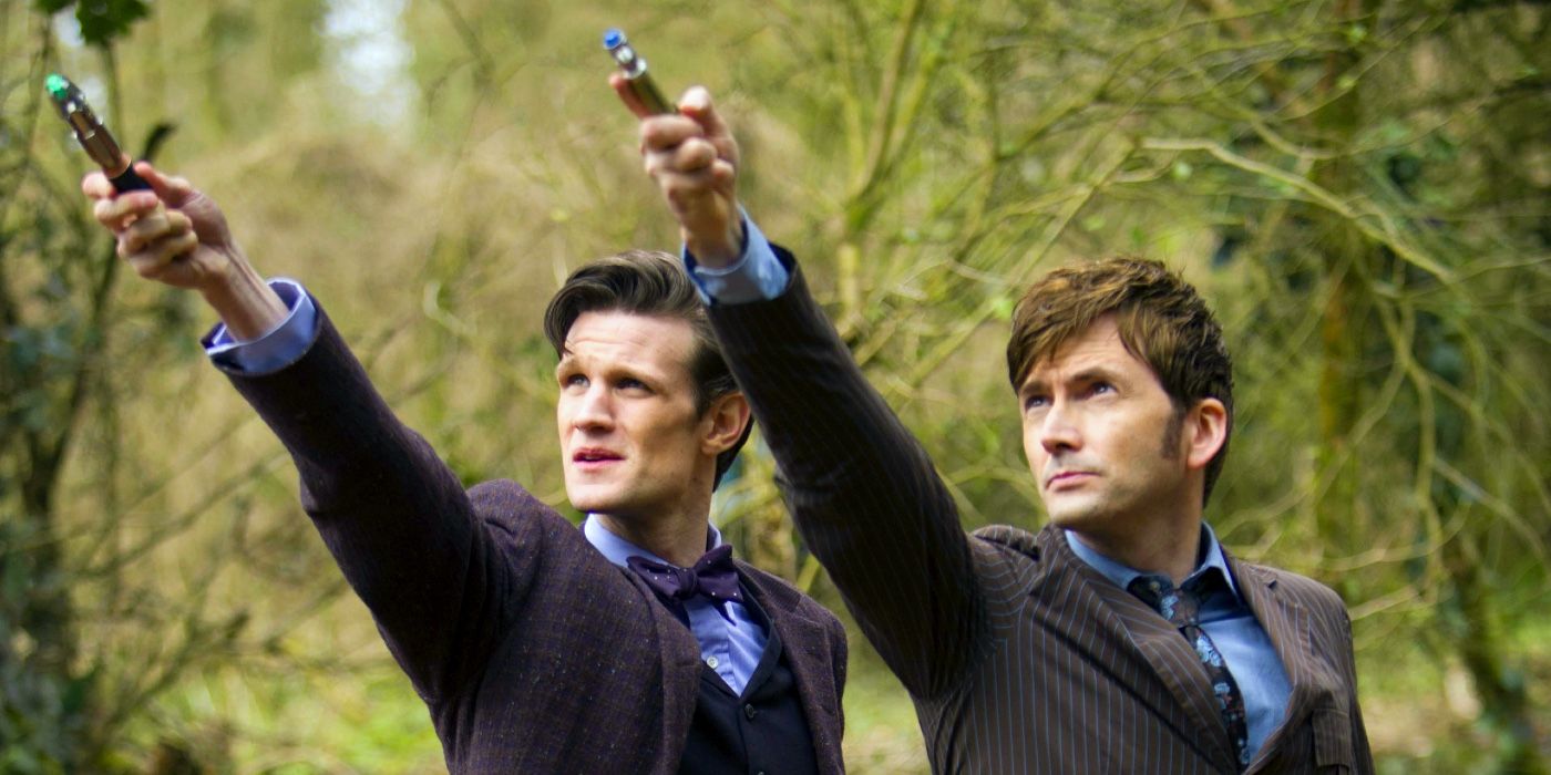 The Tenth and Eleventh Doctors pointing their sonic screwdrivers towards a portal