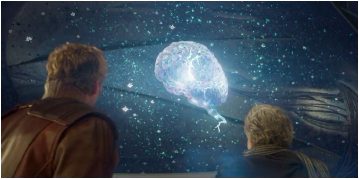 Peter Quill and Ego stare up at a Celestial-like brain