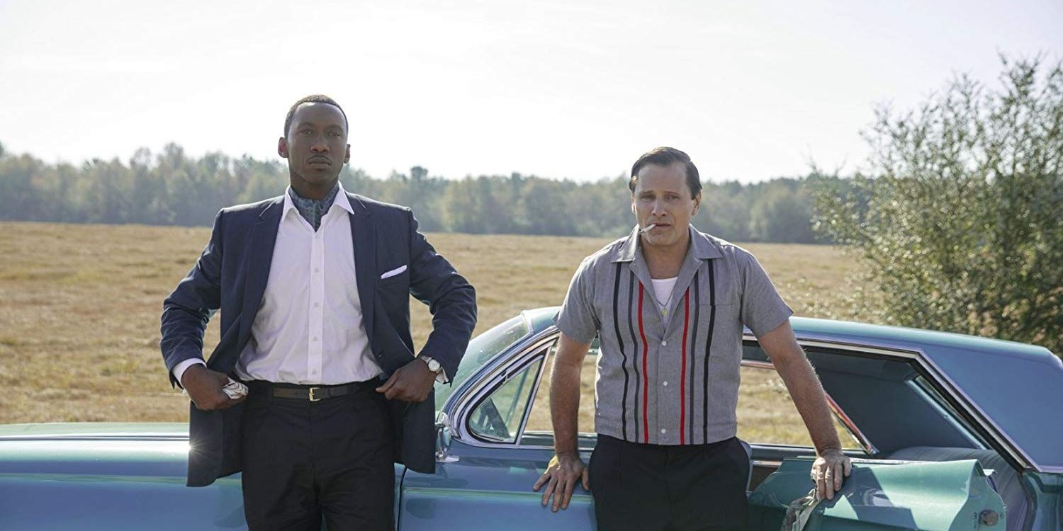 The Green Book Cast, next to the car