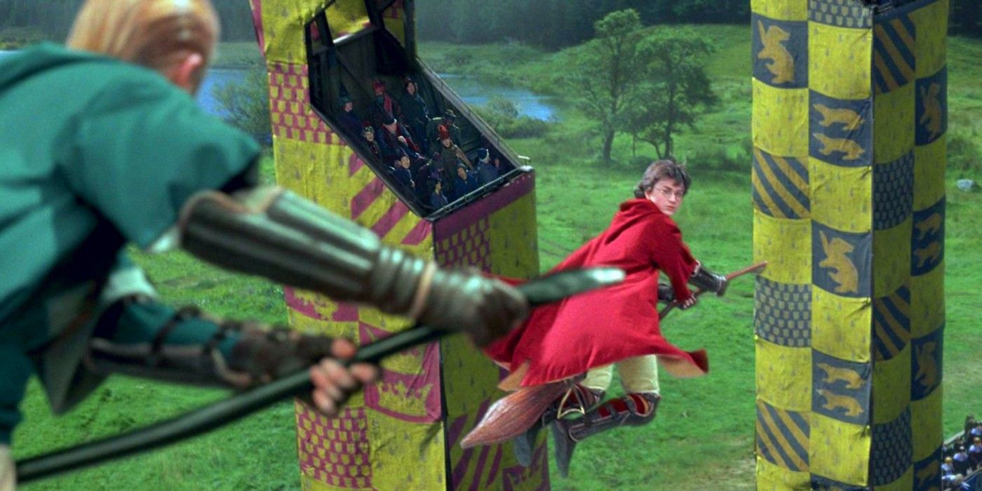 During a Quidditch match, Harry Potter looks over his shoulder at Draco Malfoy 