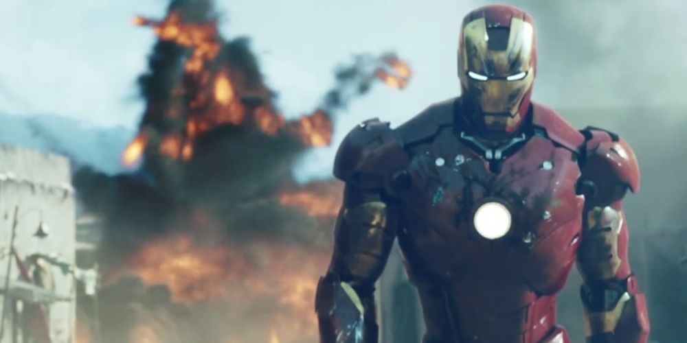 Iron Man in front of an exploding building in Iron Man.