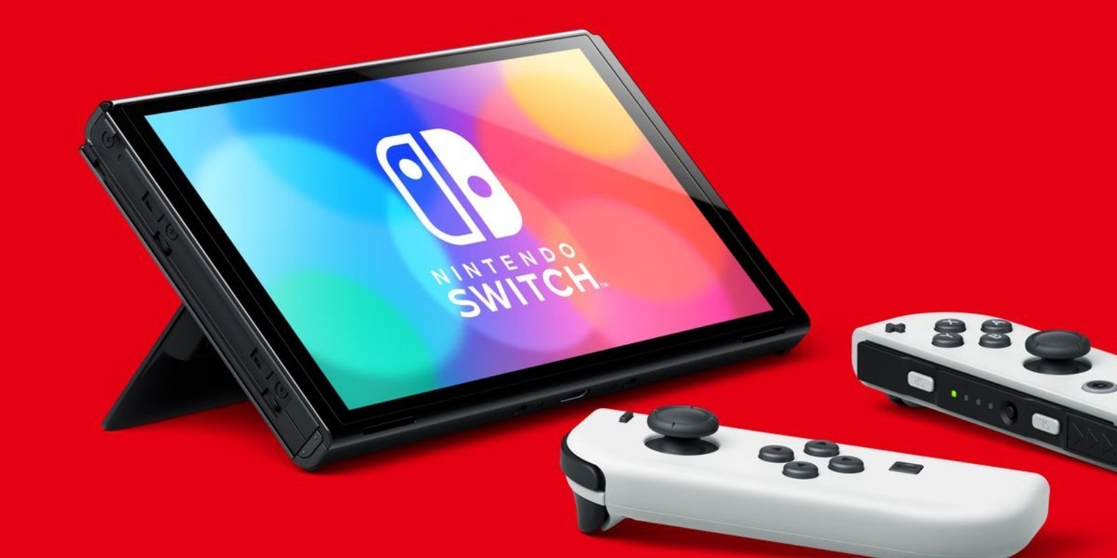 A Nintendo Switch OLED Model with two detached Joy Cons on a red background