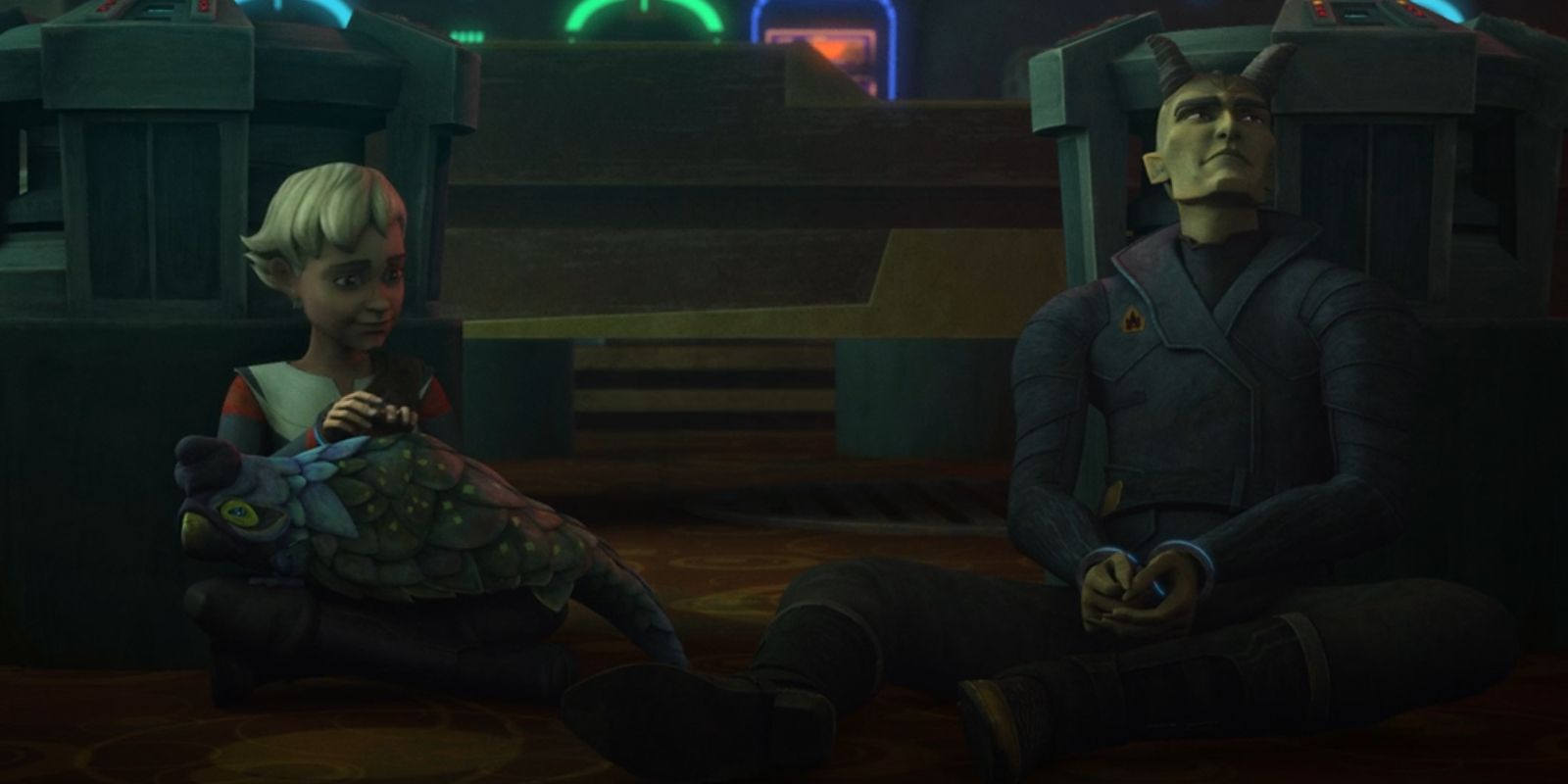 Omega sits with Ruby in her lap, and Roland Durand sits nearby in Star Wars The Bad Batch. Both Omega and Roland are in handcuffs.