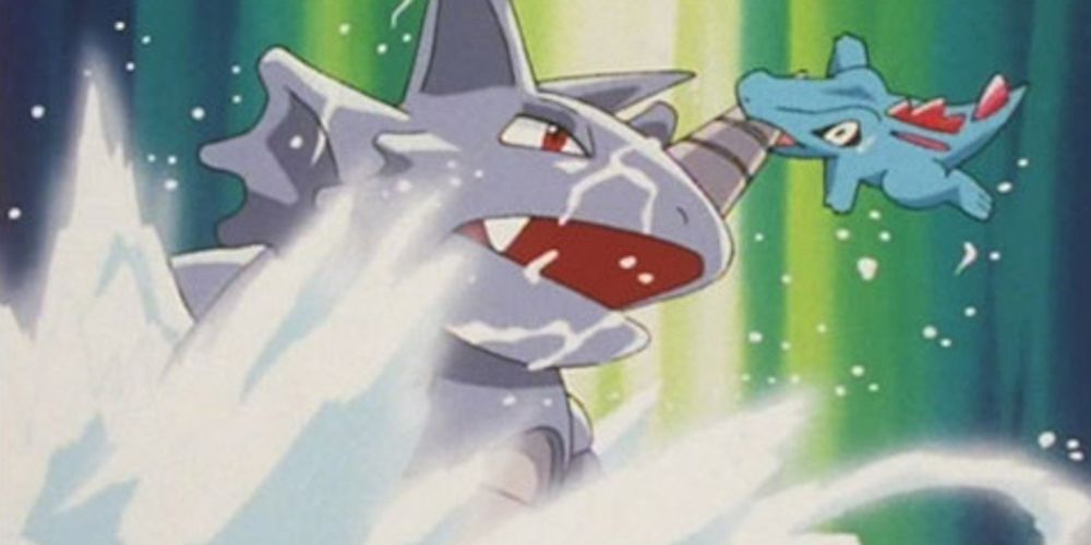 Totodile attacks a much larger Rhydon in the Pokémon anime