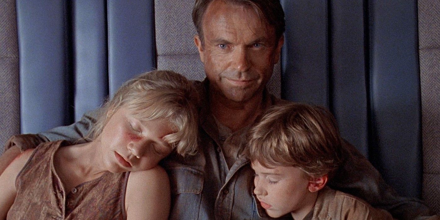 Grant holding Lex and Tim as they sleep in Jurassic Park