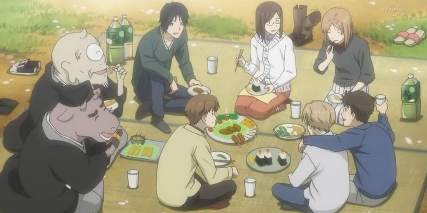 natsume and friends having a picnic with yokai.