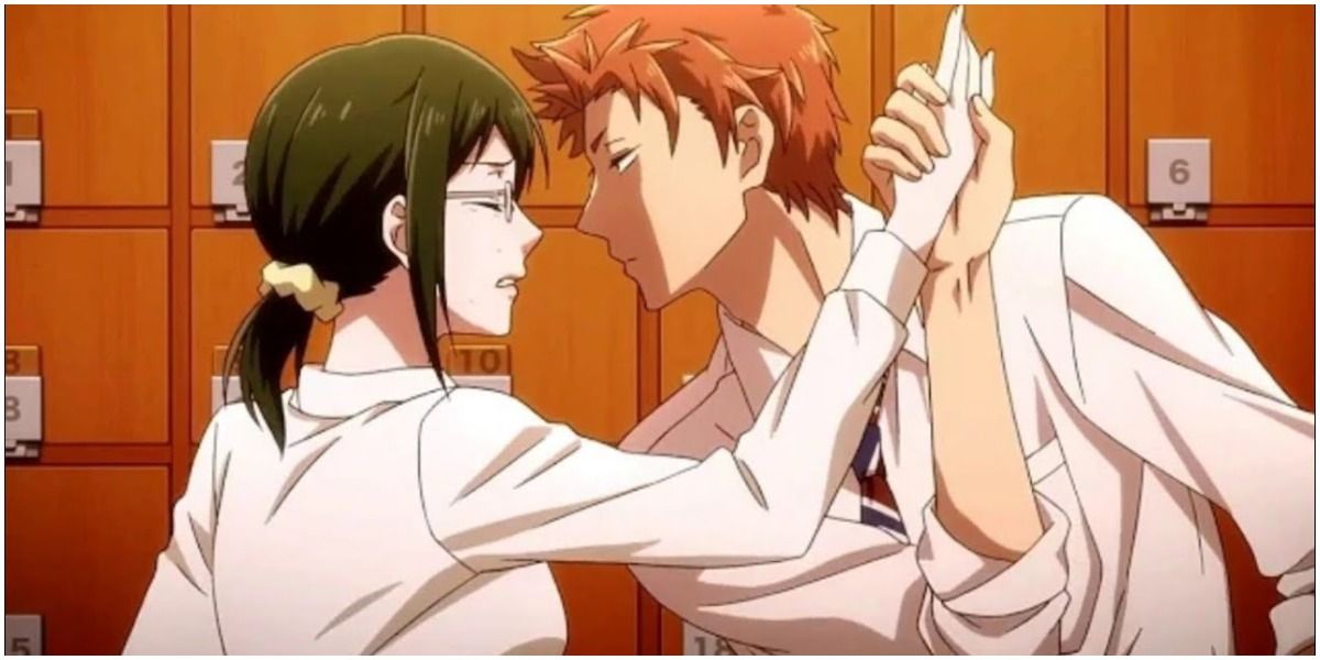 Kabakura grabbing Koyanagi's hand after she tries to slap him in Wotakoi: Love is Hard for Otaku
