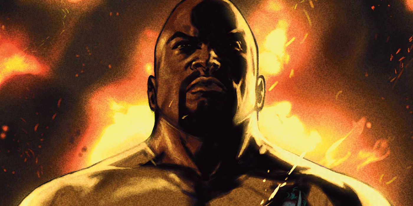 Luke Cage grimacing in front of a fire