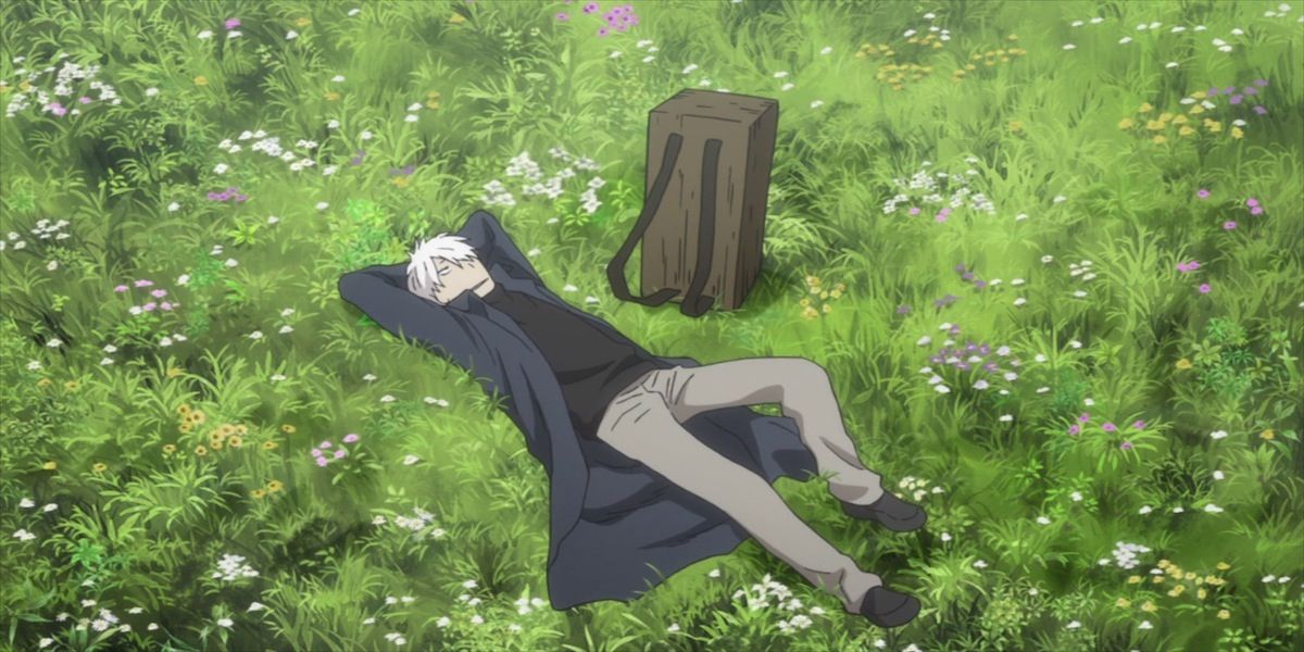 mushishi ginko laying in the grass