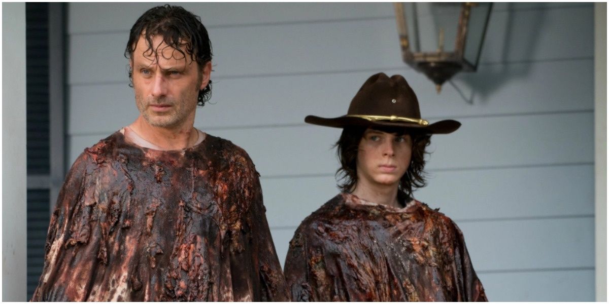 rick and carl in blood and guts covered outfits walking dead