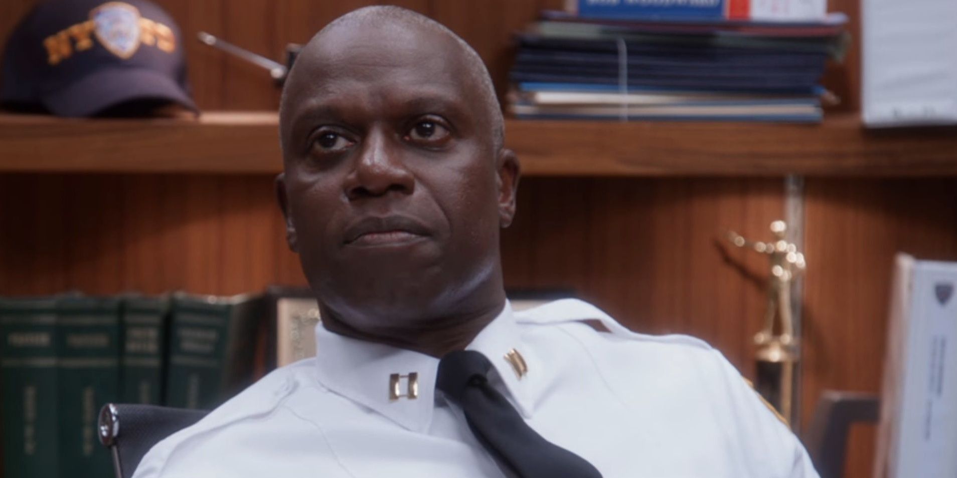 Captain Holt sitting at his desk and looking up in Brooklyn Nine Nine