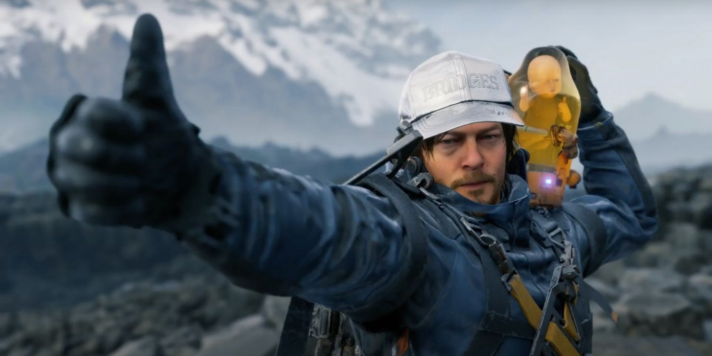 Sam Porter Bridges and his Bridge Baby giving a thumbs up to the camera in Death Stranding Director's Cut