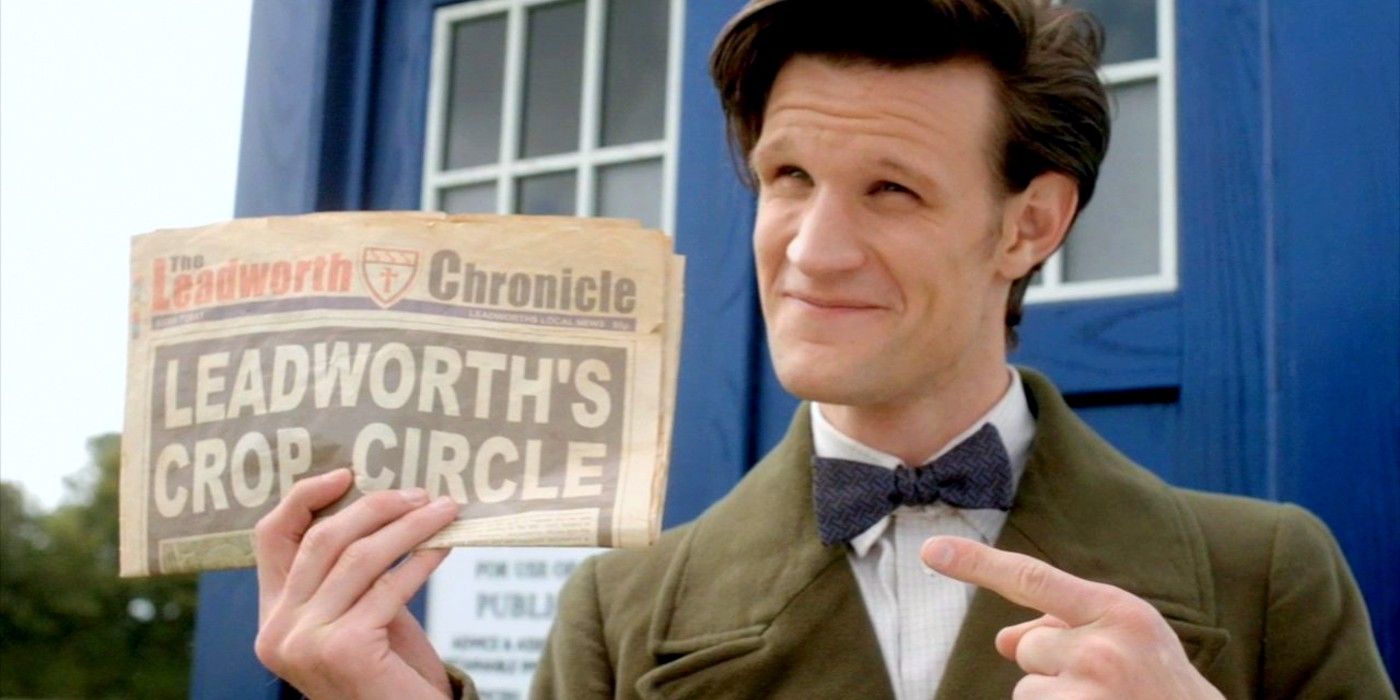 The Eleventh Doctor holding a newspaper 