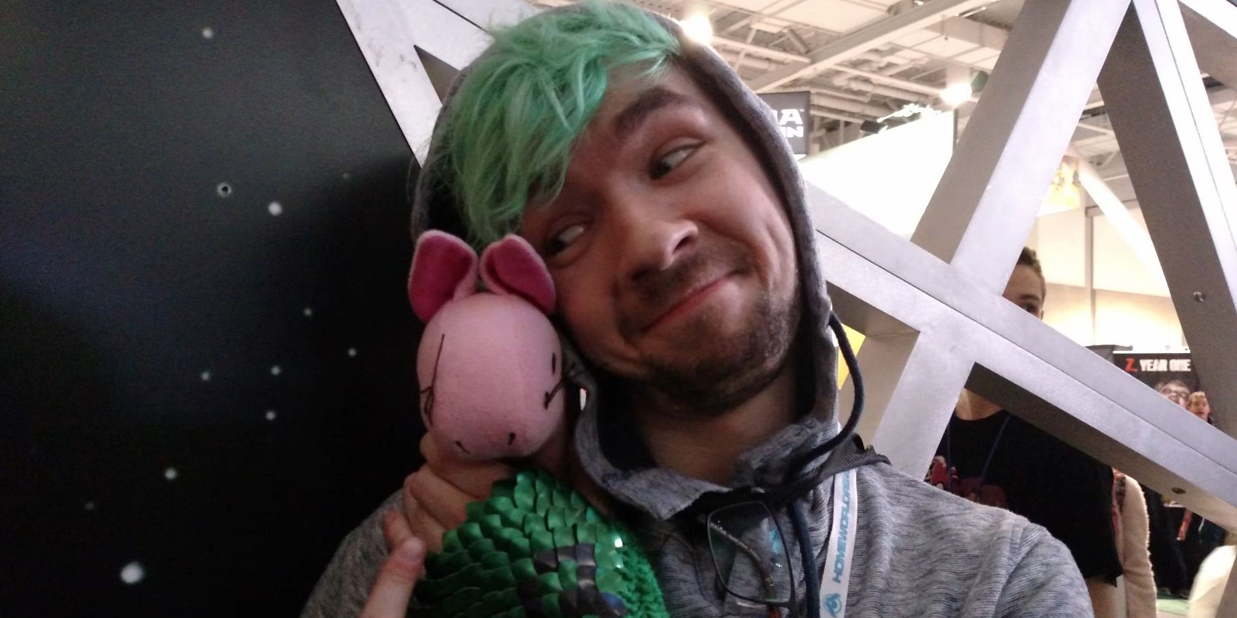 Gamer and YouTuber Jacksepticeye cuddling a cute mascot.