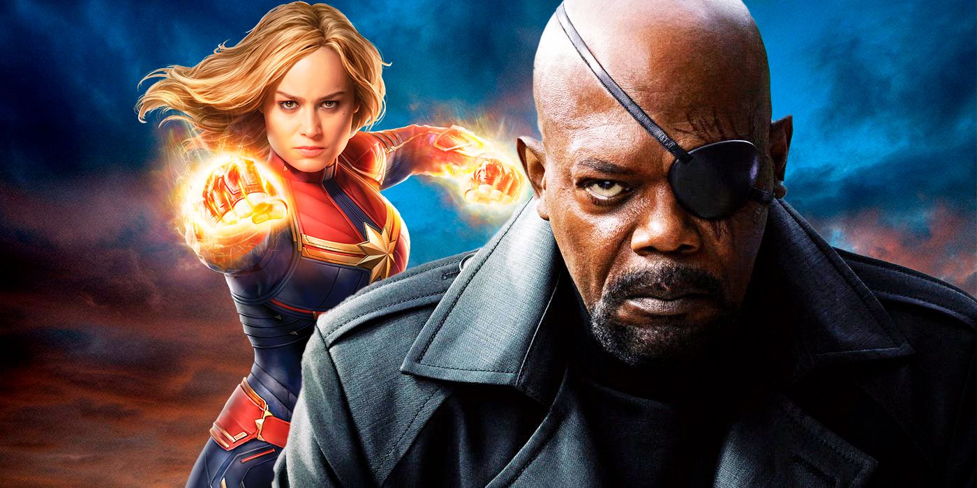 Captain Marvel with fists at the ready next to Nick Fury looking stern.