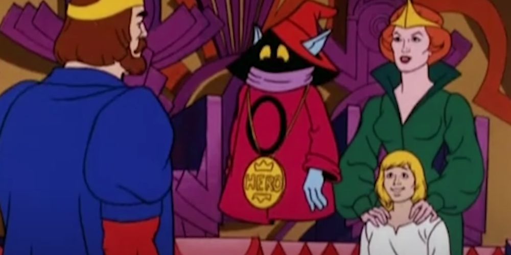 Okro and the Royal family in he man receiving his medal for saving Prince Adam. 
