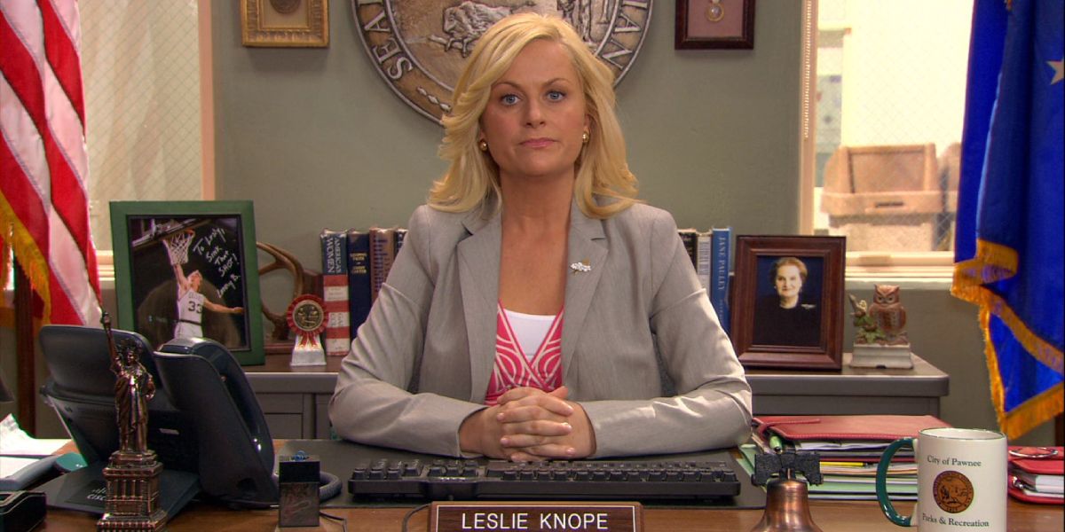 Leslie Knope looks stern at her desk