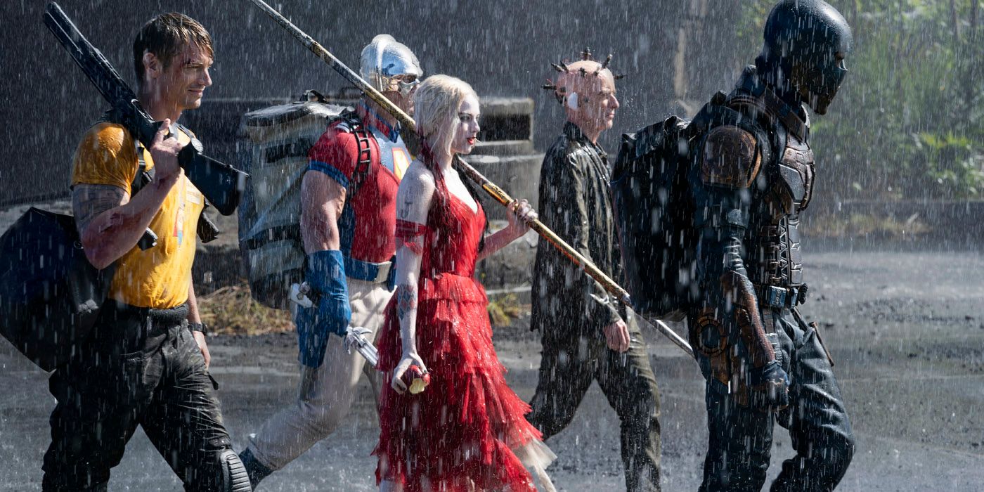 The Suicide Squad walking in the rain.