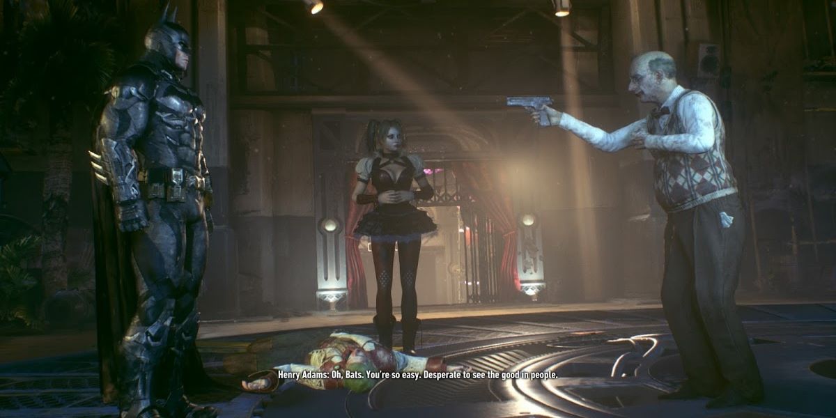 Adams pointing a gun to Batman in front of Harley Quinn