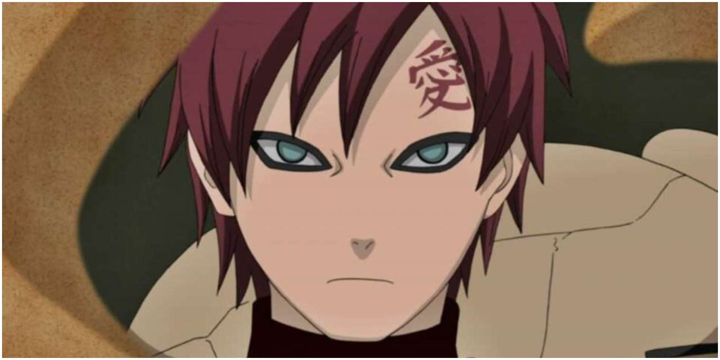 Gaara grimaces from behind a wall of his sand