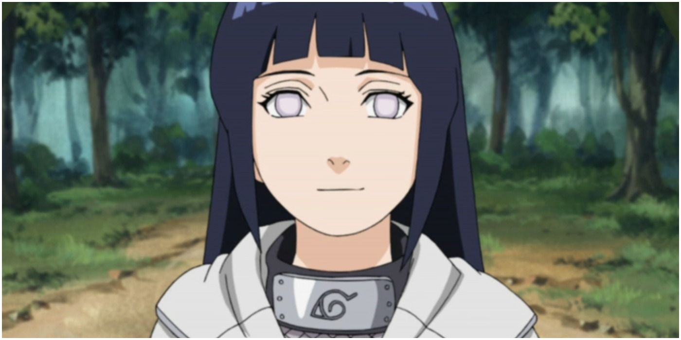 Hinata stands in the forest smiling