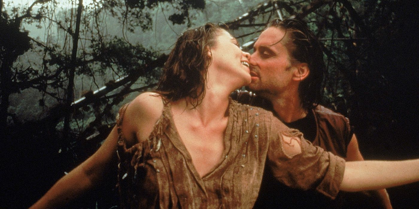 Douglas and Turner kiss in the jungle in Romancing the Stone
