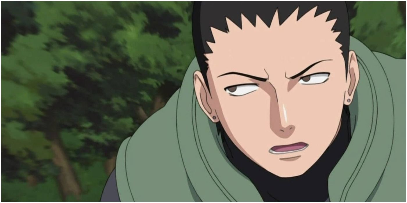 Shikamaru is running through the forest and talking with an annoyed look on his face