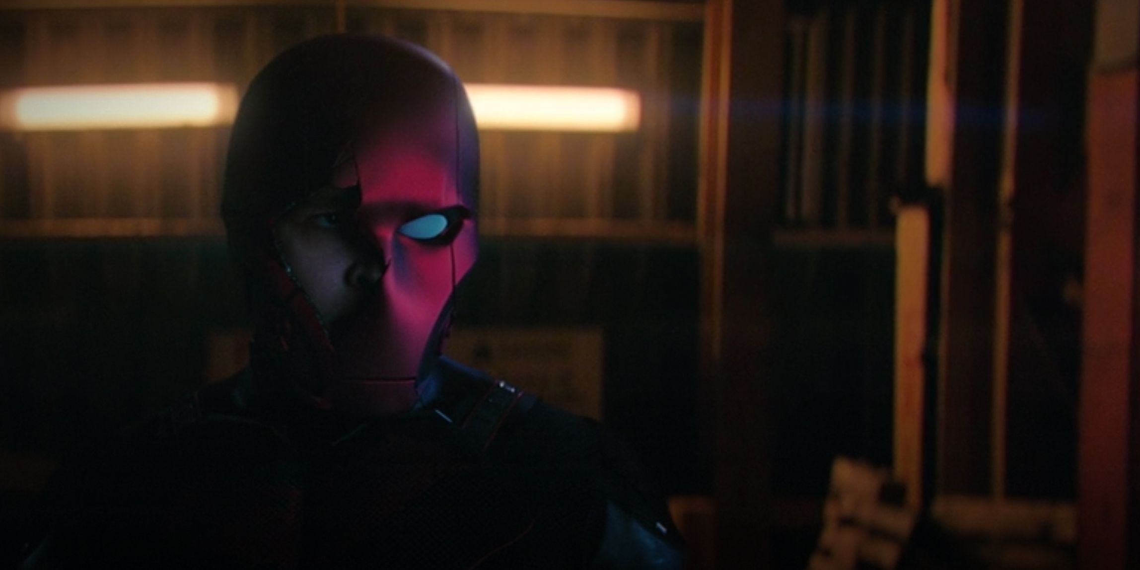 A still from Titans Season 3, Episode 2, &quot;Red Hood&quot; featuring the reveal of Curran Walters as Jason Todd/Red Hood.