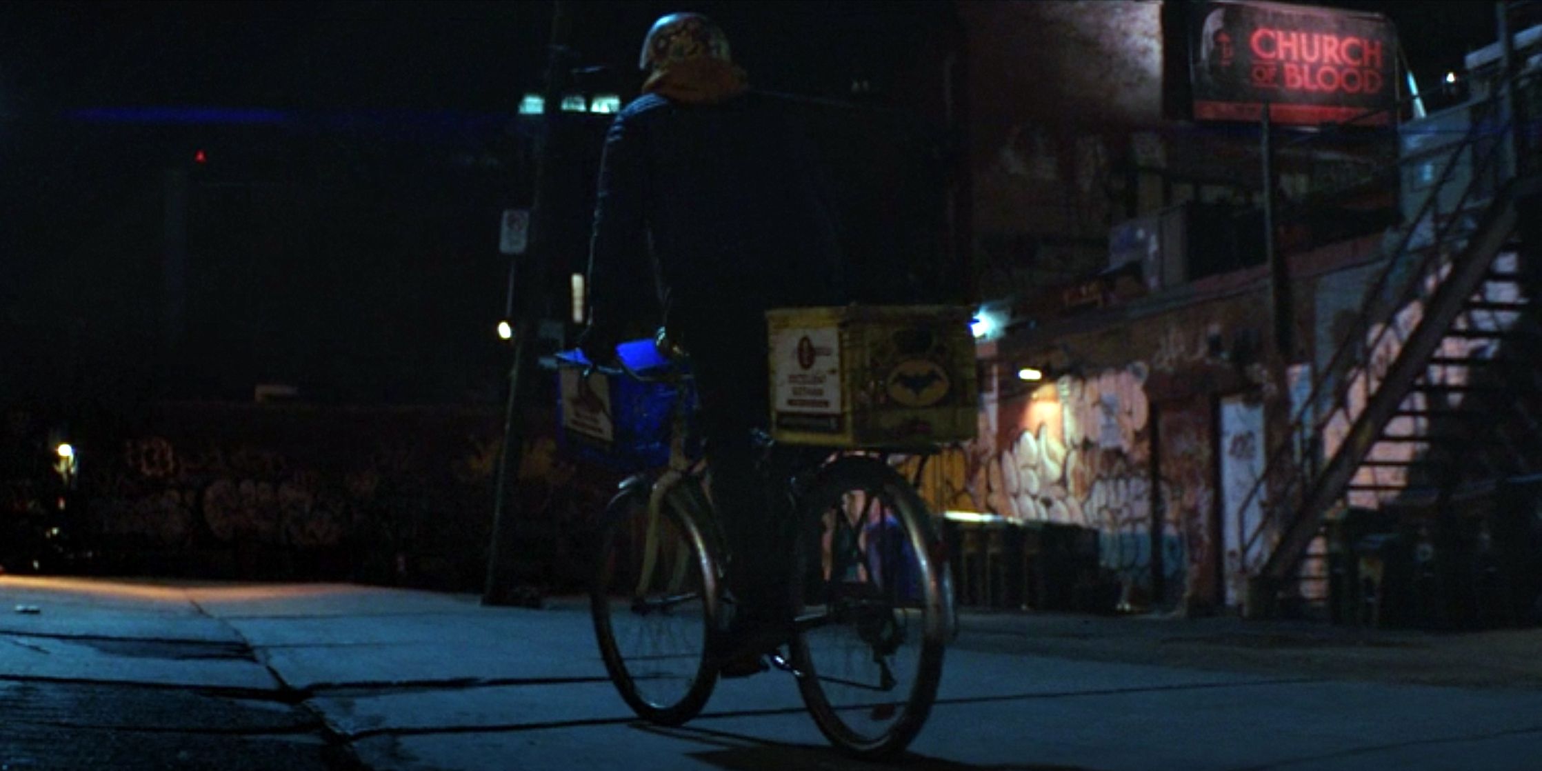 Tim Drake rides his bike near a reference fo the Church of Blood in Titans Season 3, Episode 1, &quot;Barbara Gordon.&quot;